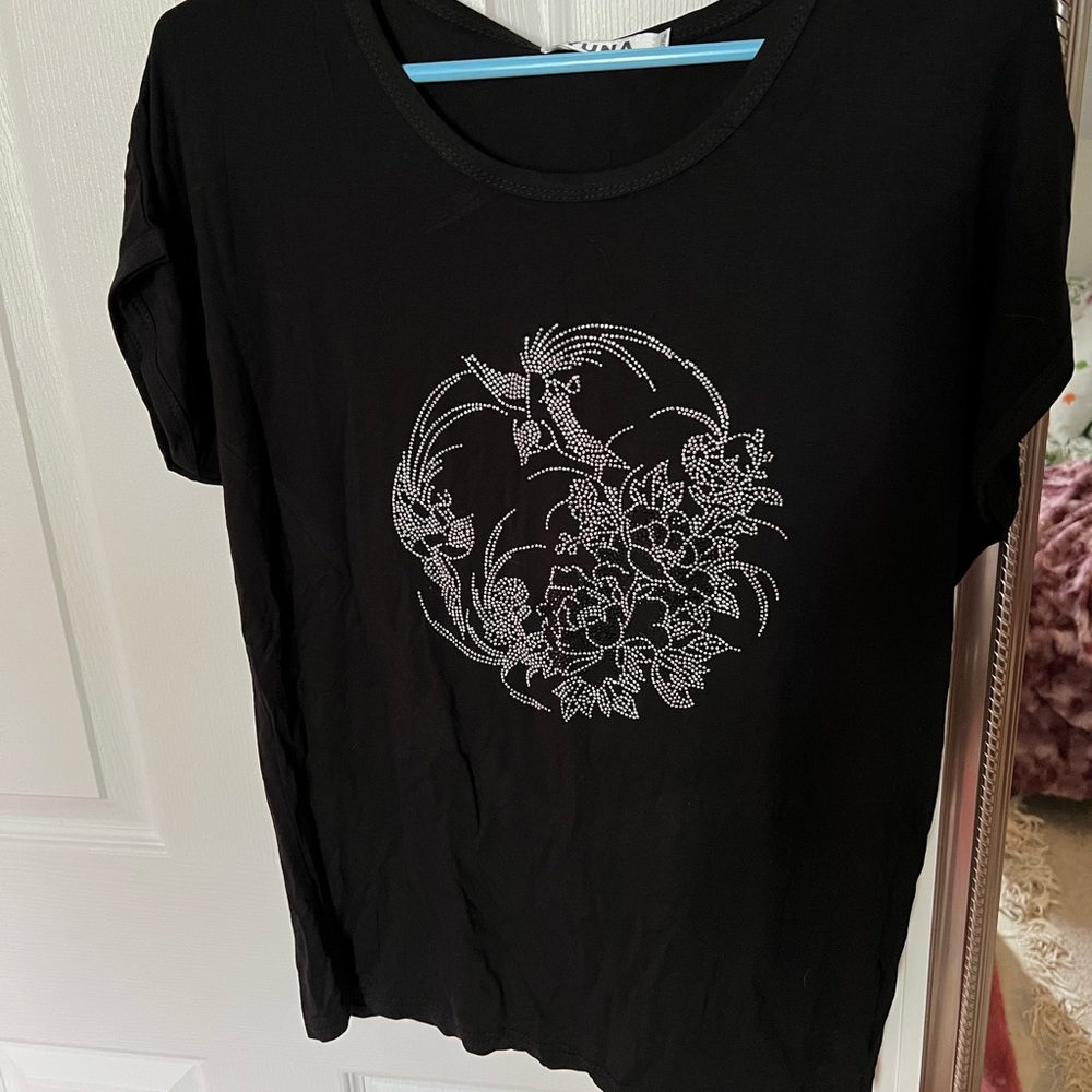 Black glitter top with cap sleeves pumpkin. Very cute , stretchy.